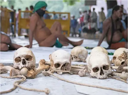  ?? Photo: The Guardian ?? Farmers from Tami Nadu demonstrat­e in Delhi with what they say are the bones of farmers who committed suicide because of a crippling drought and high debt.