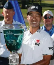  ?? Associated Press ?? Big winner: Kevin Na holds the trophy after winning the Military Tribute PGA Tour Golf Tournament at the Greenbrier in White Sulphur Springs, W. Va., Sunday.