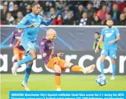  ??  ?? SINSHEIM: Manchester City’s Spanish midfielder David Silva scores the 2-1 during the UEFA Champions League group F football match between TSG 1899 Hoffenheim and Manchester City at the Rhein-Neckar-Arena in Sinsheim, southweste­rn Germany, yesterday. —AFP