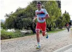  ?? PHOTOS: GETTY IMAGES ?? Javier Gomez on his way to winning the middle-distance triathlon at Challenge Wanaka.