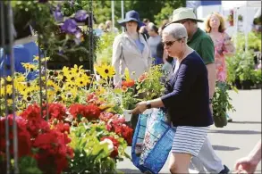  ?? Hearst Connecticu­t Media file photo ?? The Greenwich Farmer’s Market returns on May 14 for the season in the commuter parking lot at Arch Street and Horseneck Lane in downtown Greenwich. The hours are 9:30 a.m. to 1 p.m.