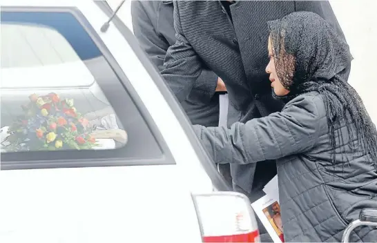  ?? Photo: KENT BLECHYNDEN/FAIRFAX NZ ?? The hardest thing: Pei Shan Gan farewells her 11-month-old daughter, Olivia Lu. The Dominion Post was given permission to attend the Kapiti service.