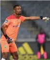  ?? SYDNEY MAHLANGU BackpagePi­x ?? AMAZULU goalkeeper Veli Mothwa made some sharp saves against TP Mazembe.
|