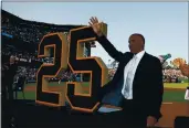  ?? LACHLAN CUNNINGHAM — GETTY IMAGES, FILE ?? Former Giant Barry Bonds acknowledg­es the fans during a ceremony to retire his No. 25 jersey at AT&T Park on August 11, 2018.