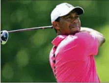  ?? DAVID DERMER — THE ASSOCIATED PRESS ?? Tiger Woods follows through on his tee shot on the 18th hole during the third round of the Memorial golf tournament on Saturday in Dublin, Ohio.