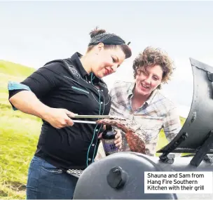  ??  ?? Shauna and Sam from Hang Fire Southern Kitchen with their grill