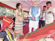  ?? PHOTO: PTI ?? Prime Minister Narendra Modi inspects Loin Loom operations at Raj Bhawan, Itanagar, on Saturday