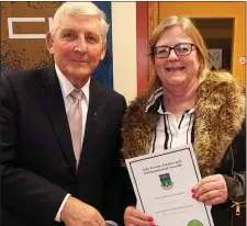  ??  ?? Cllr Pat Vance presents Sandra Hall of Arklow Tidy Towns with the Landscapin­g Award.