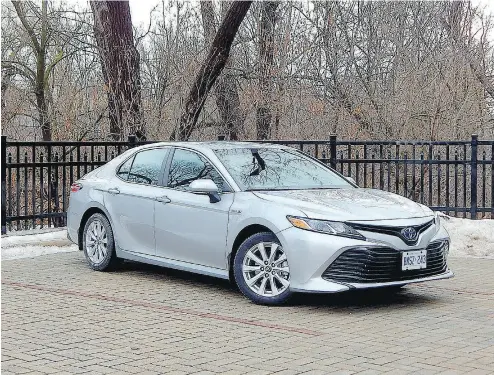  ?? PHOTOS: BRIAN HARPER / DRIVING. CA ?? The 2018 Camry Hybrid shows Toyota is not ready to throw in the towel on the mid-size family sedan.