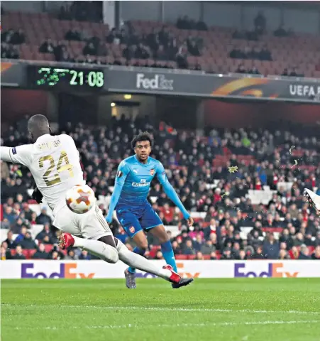  ??  ?? Sparing blushes: Sead Kolasinac fires home for Arsenal while, left, Ken Sema celebrates putting Ostersunds 2-0 up