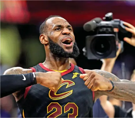  ?? AP Photo/Tony Dejak ?? CAVS SAVIOR. Cleveland Cavaliers' LeBron James celebrates after scoring the game-winning shot in the second half of Game 5 of an NBA basketball first-round playoff series against the Indiana Pacers, Wednesday, April 25, 2018, in Cleveland. The...