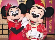  ?? DISNEYLAND RESORT ?? Mickey Mouse and Minnie Mouse are also getting into the act for the Lunar New Year celebratio­n at Disney California Adventure Park in Anaheim, Calif.