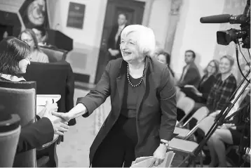  ??  ?? Federal Reserve Chairwoman Janet Yellen greets educators at the Federal Reserve Board Building January 12, in Washington, DC. Speaking on the eve of the inaugurati­on of President-elect Donald Trump, Yellen also repeated her opposition to a...