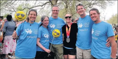  ??  ?? Supporters of the Youth Sport Trust ( YST) pictured with Lucy Fenton (third from right) after she had completed the London Marathon.