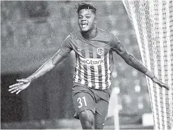  ??  ?? Jamaica’s Leon Bailey of Genk celebrates after scoring during the Europa League group stage between Genk and Sassuolo at the Cristal Arena in Genk, Belgium, on September 29.