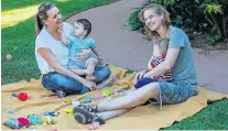  ??  ?? HANDS-ON: Sleep coach Raylene de Villiers, left, with client Samantha Cary and her formerly sleepless twins, Hayden and Riley