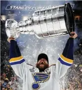  ?? Bruce Bennett / Getty Images ?? Captain Alex Pietrangel­o has the honor of being the first Blues player to lift the Stanley Cup, savoring a moment that was 52 years in the making for the franchise. The Blues had the fewest points in the league in early January.