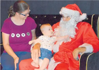  ??  ?? Abigail Pearce’s then 6-month-old daughter Susan met Santa for the first time in his Grotto last Christmas.