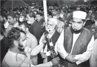  ?? ?? ISLAMABAD
Federal Minister for Interior, Sheikh Rashid Ahmed attending State Funeral of Nuclear Scientist D. Abdul Qadeer Khan at Faisal Mosque. -APP