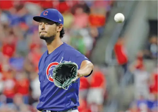  ?? JOHN MINCHILLO/AP ?? Yu Darvish reacts after allowing a solo home run to the Reds’ Joey Votto in the sixth inning. Three of the four hits Darvish allowed were home runs.