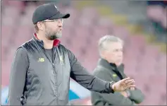  ??  ?? Liverpool’s German coach Jurgen Klopp (left) gives instructio­ns during the UEFA Champions League group C football match between Napoli and Liverpool on Oct 3 file photo at the San Paolo stadium in Naples. — AFP photo