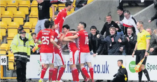  ??  ?? Party time Saints players and their supporters celebrate at Livingston