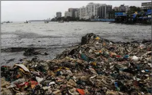  ?? (AP/Rajanish Kakade) ?? Plastic and other trash show up washed ashore on the Arabian Sea coast in Mumbai, India, Monday, Aug. 9, 2021.