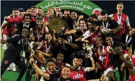  ?? Photograph: fleetwoodu­nitedfc/instagram ?? Fleetwood United players and staff celebrate on 6 April 2024 after winning the United Arab Emirates second division.