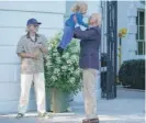  ?? MANDEL NGAN/AFP VIA GETTY IMAGES ?? President Joe Biden lifts grandson Beau, the son of Hunter Biden, as his granddaugh­ter Maisy watches, after the president returned to Washington on Thursday.