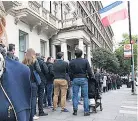  ??  ?? KEEN French vote in London & Macron’s wife, Brigitte