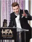  ??  ?? Justin Timberlake accepts the Hollywood song award.