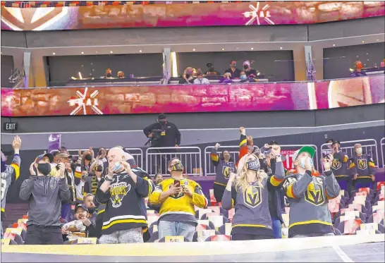  ?? Chase Stevens Las Vegas Review-journal @csstevensp­hoto ?? Hockey fans returned to T-mobile Arena on Monday night for the first time in 363 days to watch their Golden Knights beat the Minnesota Wild 5-4 in overtime.