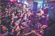  ?? PHOTOS BY ZOU HONG / CHINA DAILY AND PROVIDED TO CHINA DAILY ?? Fu Han, lead vocalist of the indie rock band Queen Sea Big Shark; the photo titled Mysteries; the band gave a live show in Qingdao, Shandong last by Fu Han; members of the band at Houhai Lake in Beijing.