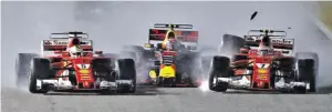  ?? BILD: SN/AP ?? Verstappen in der Zange von Vettel (l.) und Räikkönen.