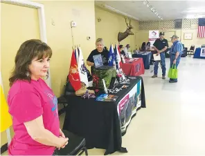  ?? Staff photo by Greg Bischof ?? ■ Vendors offer their medical, educationa­l, employment and assisted living services to local military veterans during the 25th annual Veterans Informatio­n Fair on Saturday at the Elks Lodge in Texarkana, Texas. The annual event is organized by Vietnam Veterans of America, Chapter 278.