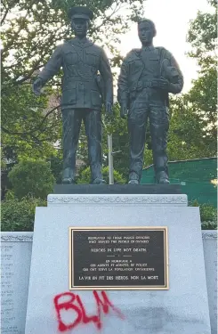 ?? twitter .com/ edmontonpo­lice; twitter . com/ OPP; David Bloom / Postmedia ?? Recently, police monuments have been vandalized, including the base of the statue of Const. Ezio Faraone in Edmonton; the Ontario Police memorial in Toronto and a plaque for Const. William L. Nixon in Edmonton.