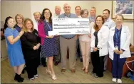  ?? Janelle Jessen/Herald-Leader ?? La-Z-Boy Foundation presented a $2,630 check to Community Clinic Siloam Springs Medical on Wednesday morning to be used for an exam table and outreach supplies. Pictured, from left, are Jennifer Murillo, Community Clinic patient coordinato­r; Audra...