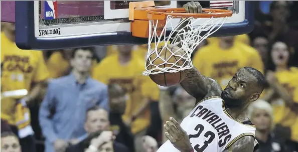  ?? FRANK GUNN/THE CANADIAN PRESS ?? Cleveland Cavaliers forward LeBron James dunks during the first half of a convincing win over the Toronto Raptors in Game 5 in Cleveland on Wednesday.