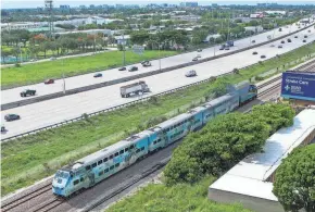  ?? PROVIDED ANDRES LEIVA/PALM BEACH POST ?? A train departs from the Delray Beach Tri-Rail station in Delray Beach in June. Tri-Rail is offering a subsidy on Uber, taxi services.