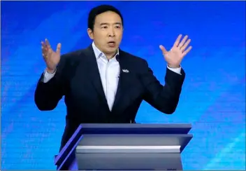  ?? AP Photo/Elise Amendola ?? In this Feb. 7 file photo, then-Democratic presidenti­al candidate entreprene­ur Andrew Yang speaks during a Democratic presidenti­al primary debate at Saint Anselm College in Manchester, N.H.