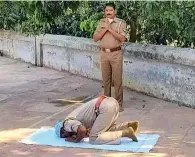  ?? IANS ?? Constable Asghar Khan and inspector r.p. Sharma offering prayers at the eidgah ground in hasanpur, uttar pradesh. —