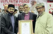  ??  ?? Bishop Rubin Phillip, cenre, with Hassan Qadri and MPL Rafeek Shah.