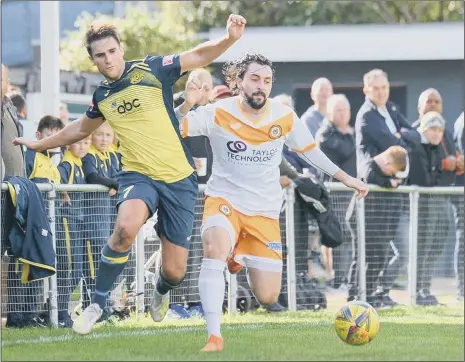  ??  ?? FA CUP ACTION
Moneyfield­s’ Joe Briggs, left, battles for possession during his side’s 6-2 loss to Cray Wanderers