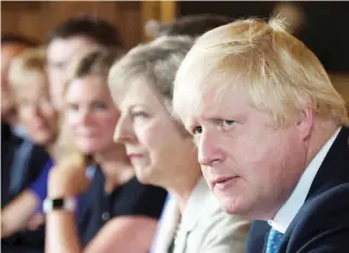  ??  ?? British Prime Minister Theresa May and Foreign Secretary Boris Johnson attend a meeting in Buckingham­shire in this file photo. (Reuters)