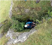  ?? PHOTO: ALAN TENNYSON ?? A Te Papa staff member descends into the cave.