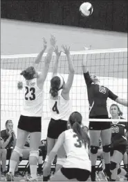  ?? COURTESY PHOTO ?? Prairie Grove and Lincoln battle it out over the net. Prairie Grove defeated Lincoln 3-0 in a hard-fought match on Sept. 3 at the Lady Tigers’ home court.