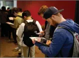  ?? ?? A line of voters at the University of Michigan