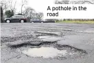  ??  ?? A pothole in the road