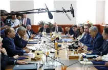  ?? (Abir Sultan/Reuters) ?? PRIME MINISTER Benjamin Netanyahu sits across from Education Minister Naftali Bennett (left) and Finance Minister Moshe Kahlon at the weekly cabinet meeting in Jerusalem yesterday.