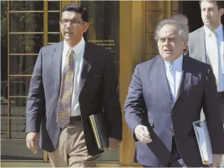  ?? AP FILE PHOTO ?? FORGIVEN: President Trump tweeted that he would pardon Dinesh D’Souza, shown above left with his lawyer Benjamin Brafman in 2014.